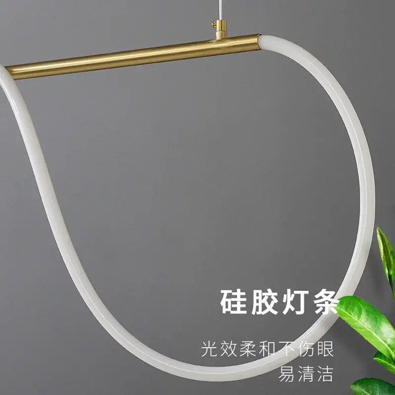 A sleek white silicone pendant ceiling chandelier with a polished gold-toned bar for nordic hose led home decor