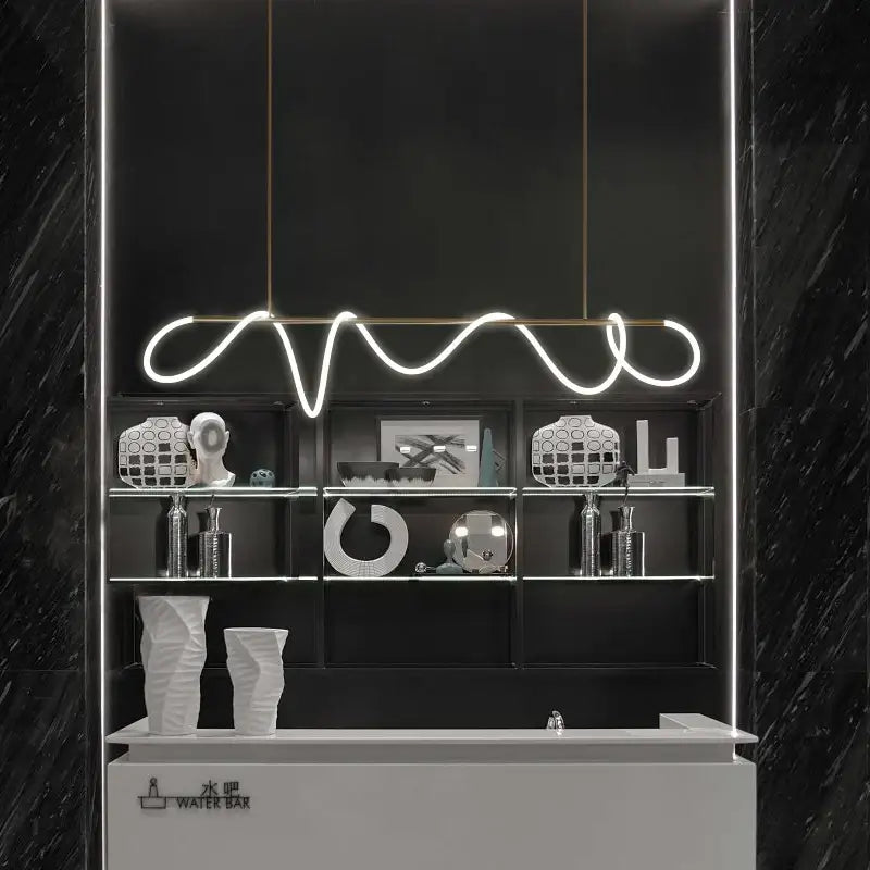 A sleek dimmable nordic hose led ceiling chandelier with white neon wave design above a black and white display shelf for home decor