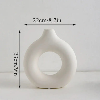 DecorBites™ white minimalist ceramic flower vase with a donut shape and smooth glossy finish