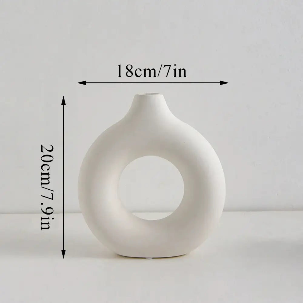 DecorBites™ donut shape flower vase in white ceramic with a smooth glossy finish and distinctive ring-shaped hole