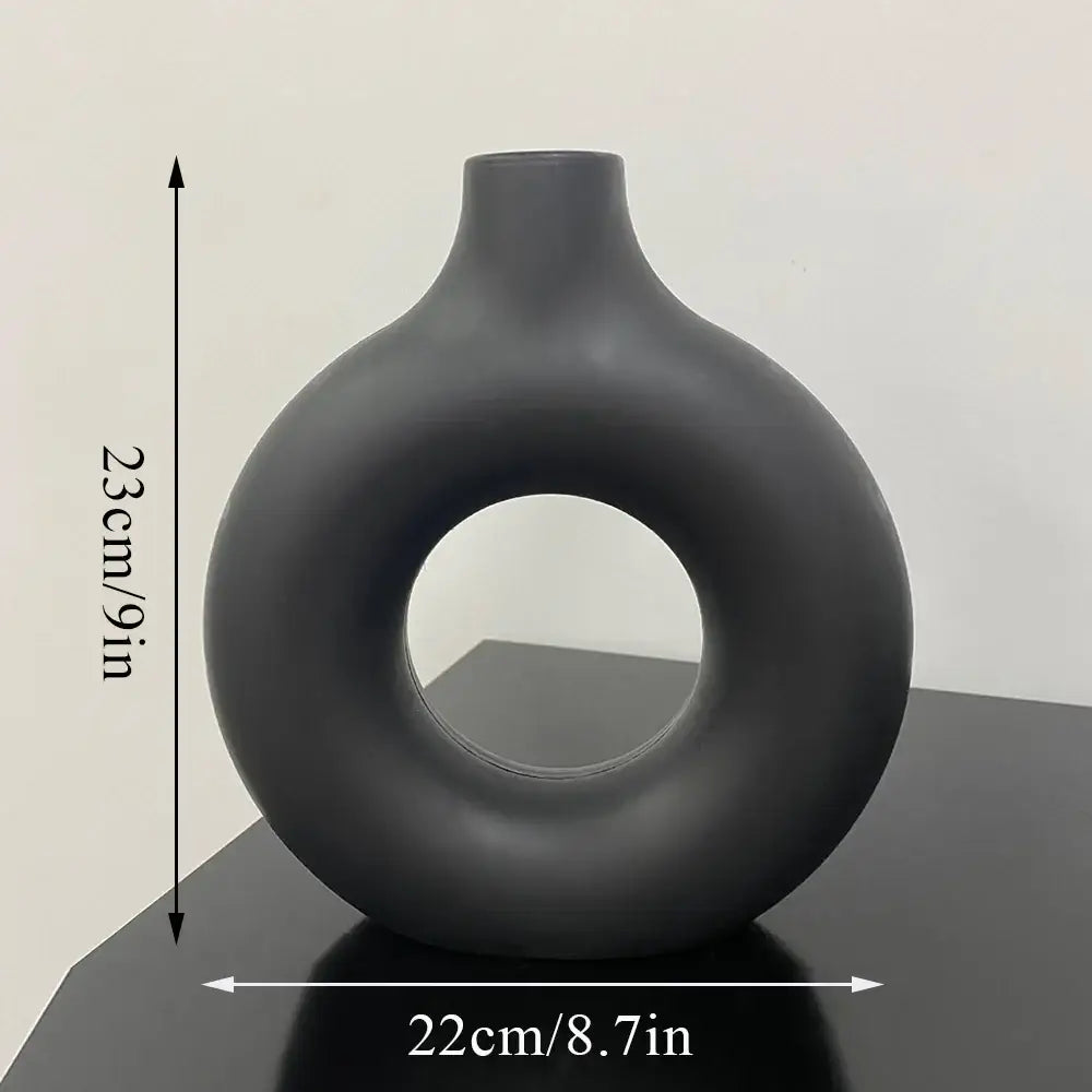 Decorbites™ donut shape flower vase in sleek matte black ceramic with modern rounded contours and minimalist design