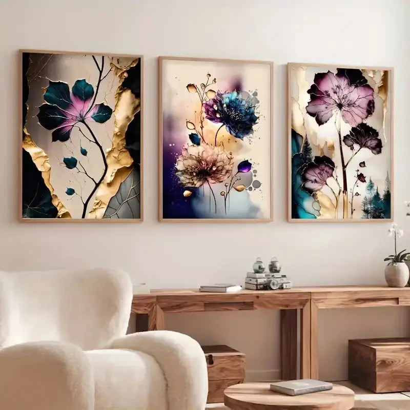 Three framed dreamy flowers canvas posters with abstract painterly designs in deep purples blues and gold accents
