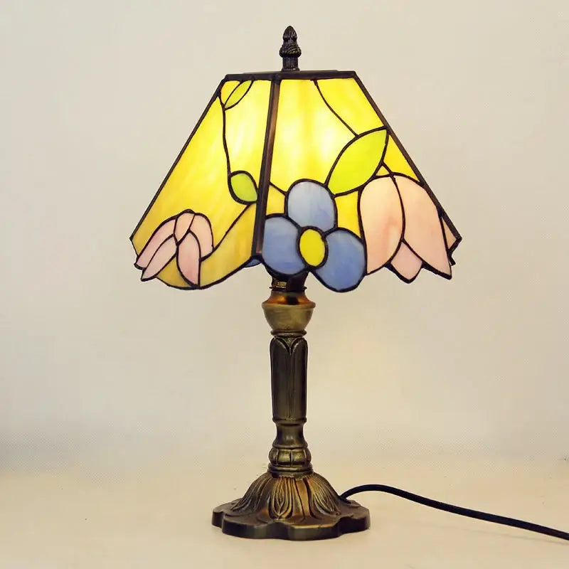 A decorbites e27 retro baroque led table lamp with a stained glass floral shade and ornate brass base for bedroom decor