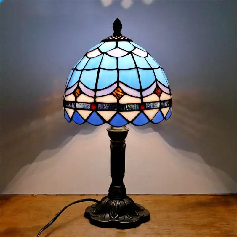 DecorBites™ e27 retro baroque led table lamp with a domed blue white amber stained glass shade and dark metal frame