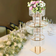 DecorBites™ elegant three-tiered gold wedding flower stand with crystal rods holding pink and white floral bouquet