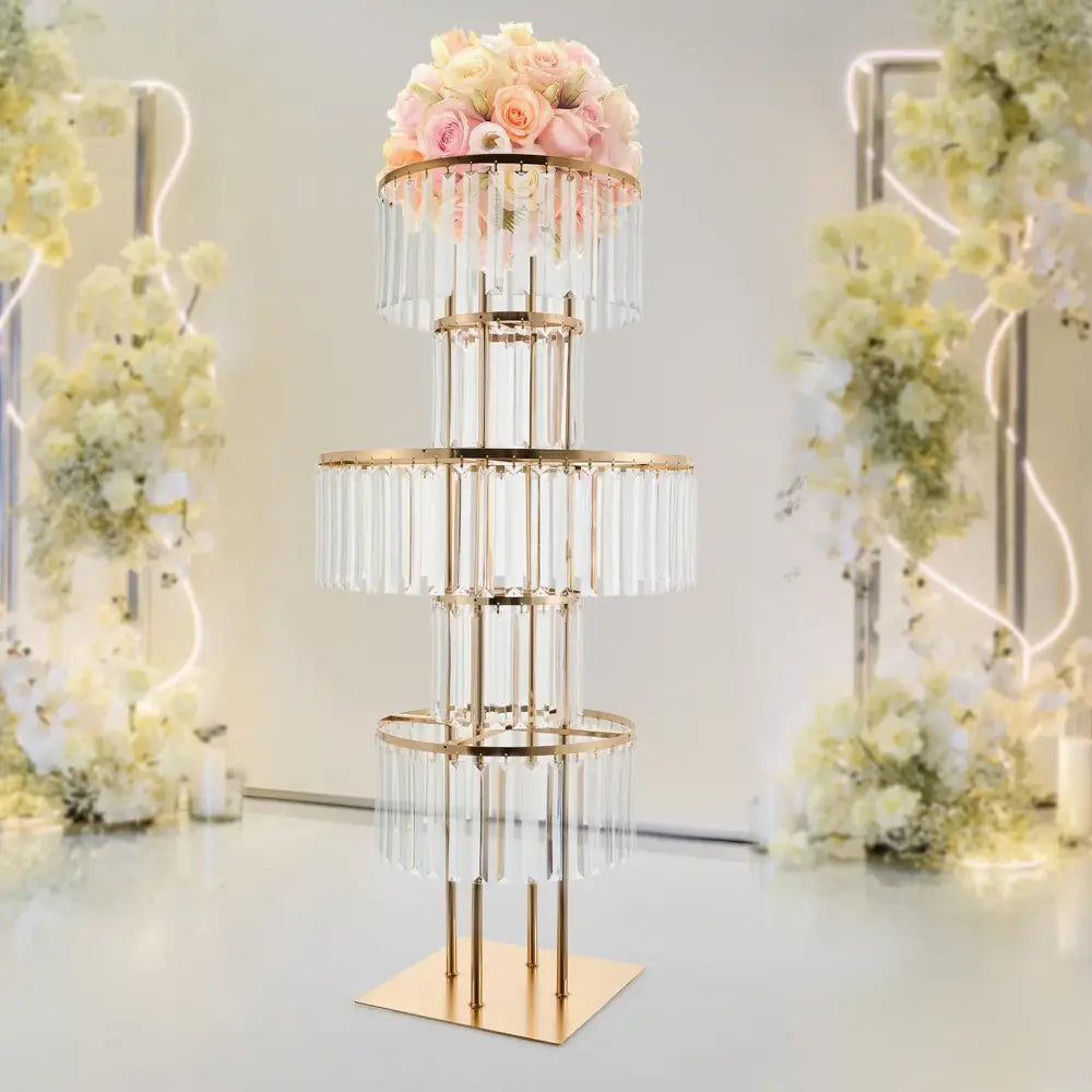 Gold-toned 5-tier wedding flower stand with clear crystal elements and a floral arrangement by DecorBites elegant flower stand