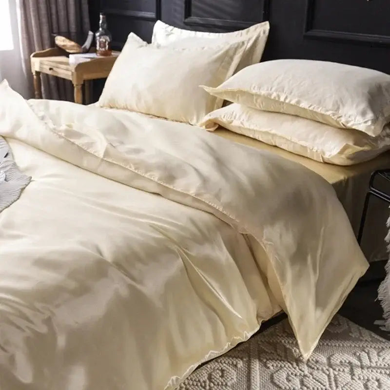 Cream-colored satin duvet cover set with matching pillows from decorbites elegant bedding ensemble ideal for width bed sheets