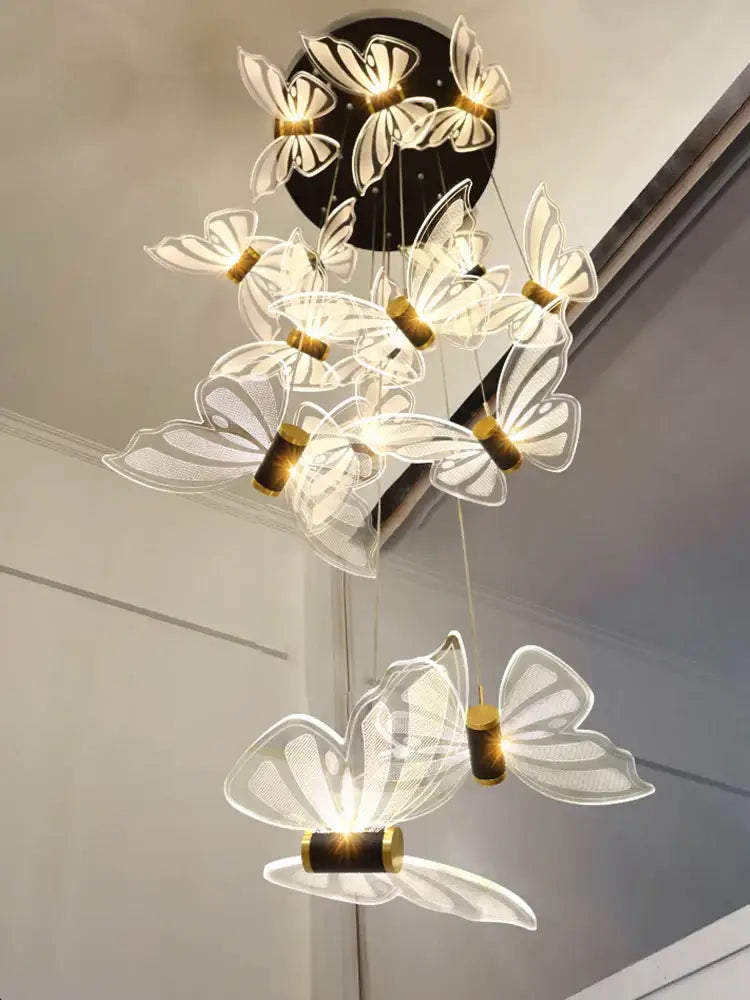 Decorbites elegant butterfly chandelier with translucent white wings and gold accents for bedroom lighting