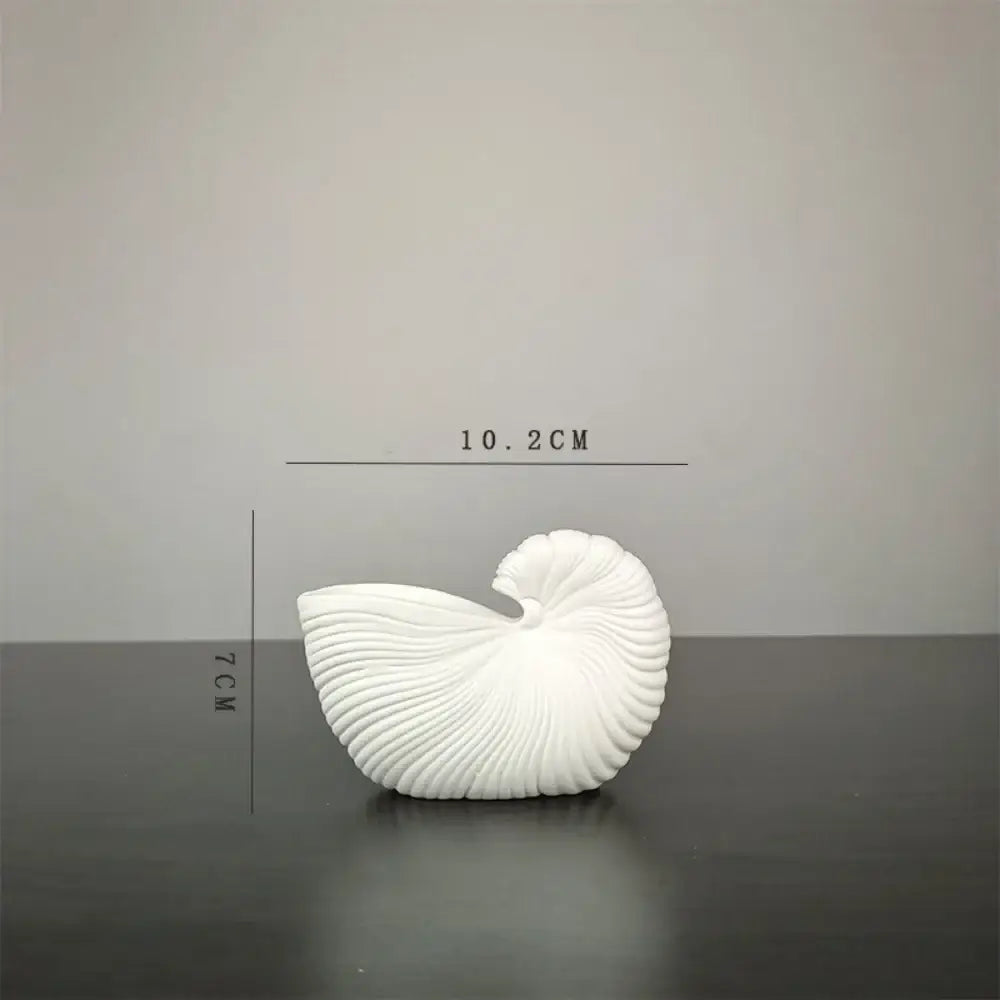 DecorBites elegant ceramic vase with a white intricately ridged shell conch design for sophisticated decor