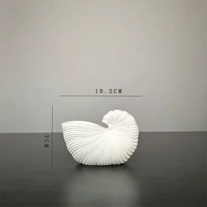 DecorBites elegant ceramic vase with a white intricately ridged shell conch design for sophisticated decor