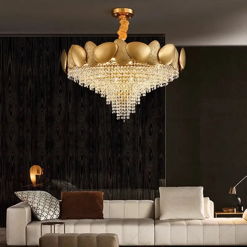 Gold-toned decorbites elegant crystal chandelier with tiered metallic petals and cascading crystal droplets for living room