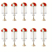 Decorbites elegant gold-toned crystal flower stands with cascading clear beads and red and white floral arrangements