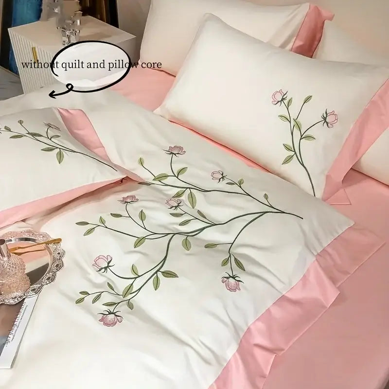 White satin pillowcases with delicate pink rose embroidery and matching pink satin piping in decorbites™ elegant embroidery duvet cover set blue pink