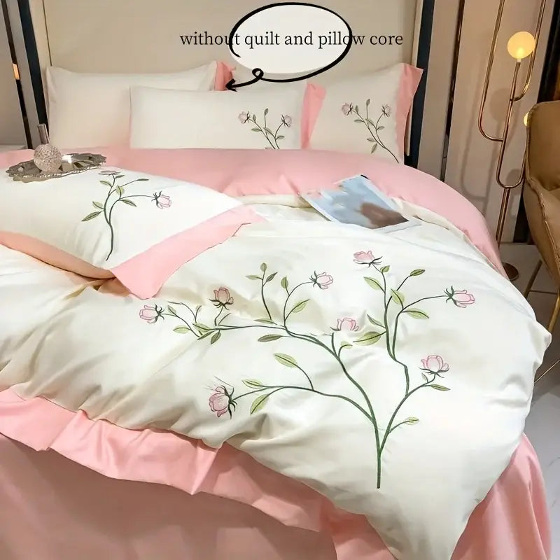 Decorbites™ elegant embroidery duvet cover set features a delicate white duvet cover with pink floral embroidery and ruffled hem