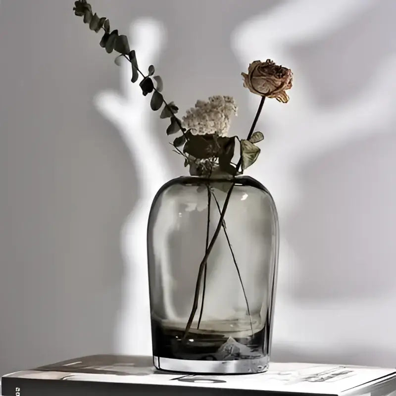 DecorBites™ elegant European INS sleek translucent gray glass flower vase with rounded body holds dried eucalyptus and roses
