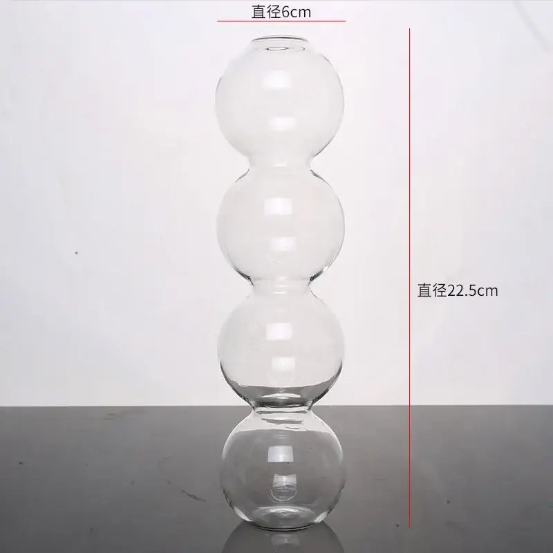 Clear glass vase with four stacked spherical sections elegant glass vase for home decor by decorbites