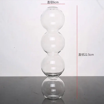 Clear glass vase with four stacked spherical sections elegant glass vase for home decor by decorbites