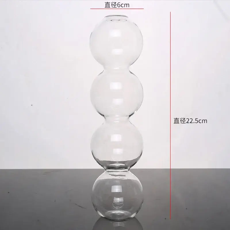 Clear glass vase with four stacked spherical sections elegant glass vase for home decor by decorbites