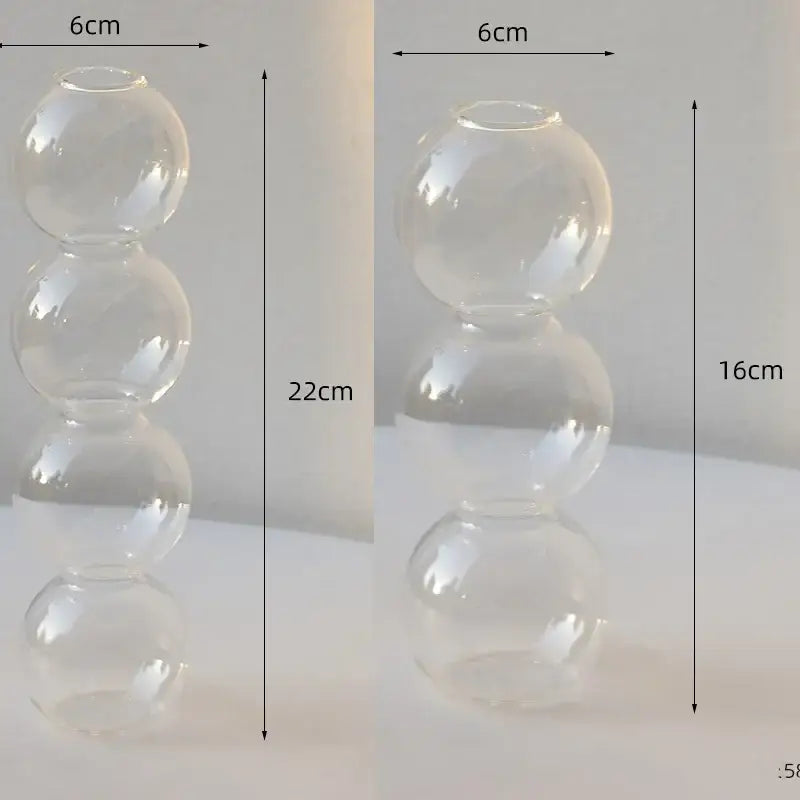 Clear glass vase with three stacked spherical sections elegant glass vase for stylish home decor by DecorBites