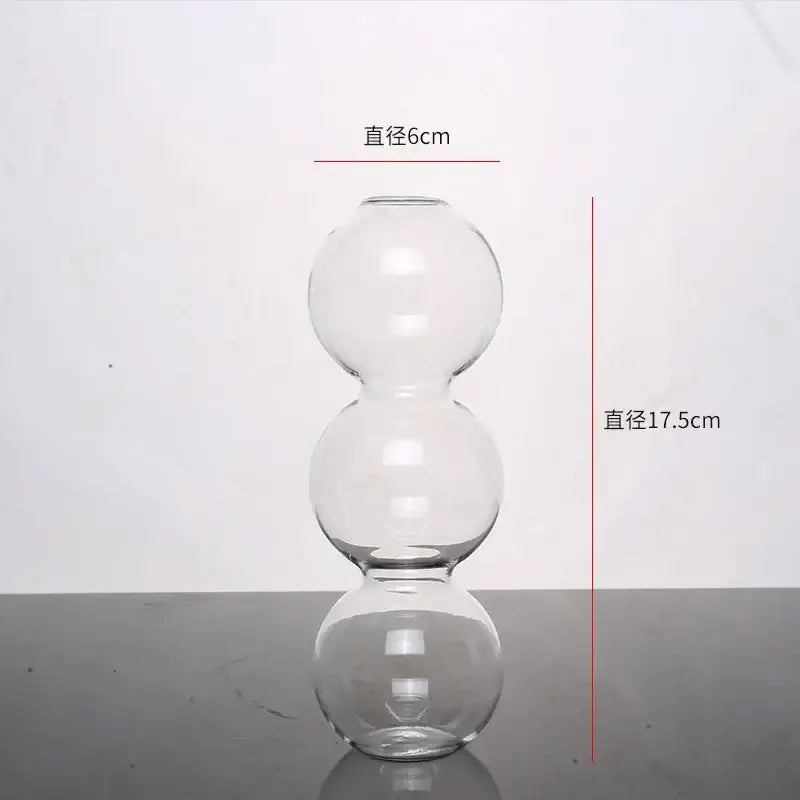 Clear glass vase with three stacked spherical sections from decorbites™ elegant glass vase home decor accent collection