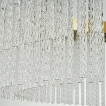 Clear twisted glass strands of the DecorBites™ elegant gold crystal chandelier with modern gold luster for home lighting