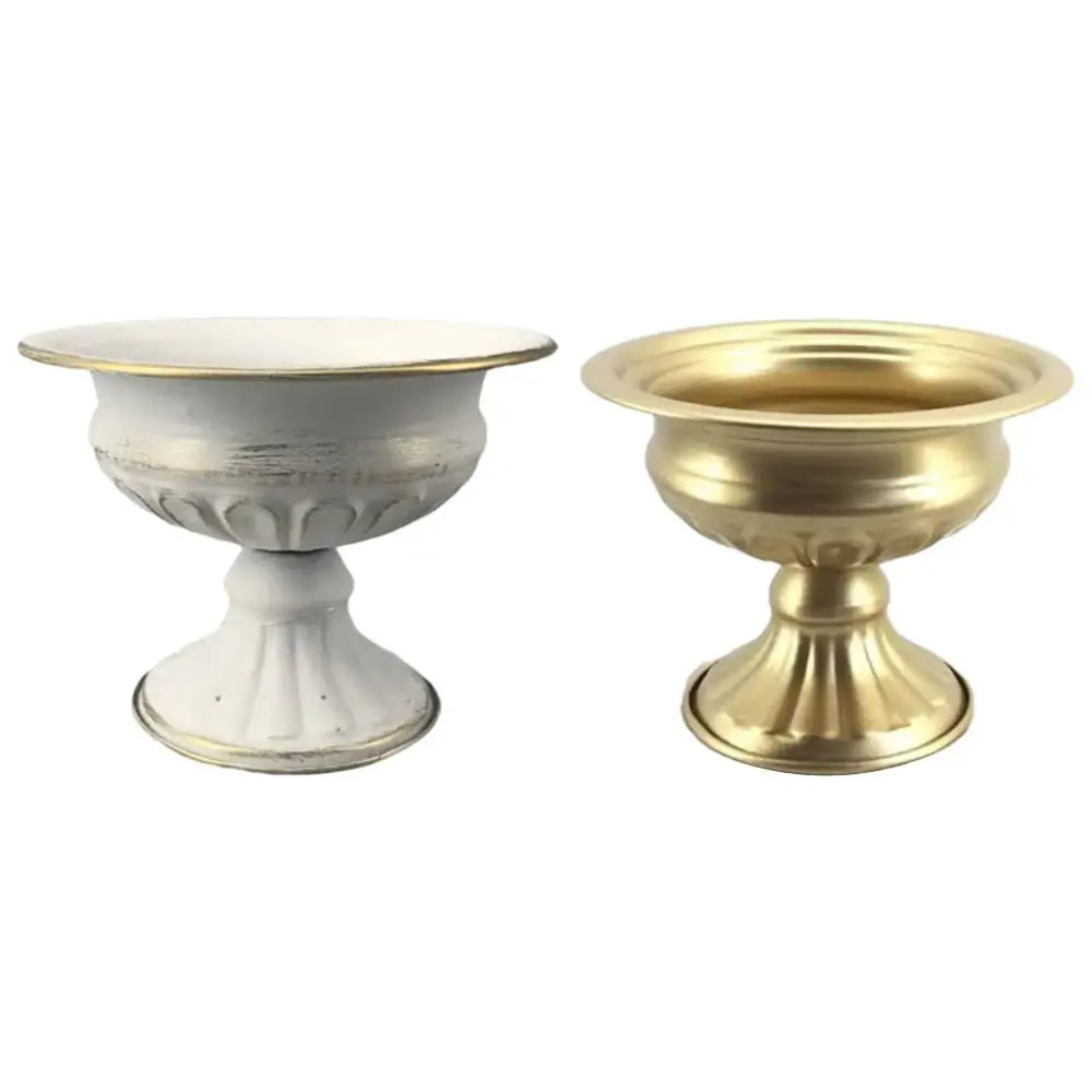 Two ornate metal flower vase candle holders by decorbites featuring fluted bases in distressed white gold and solid brass