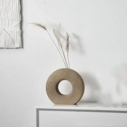 DecorBites™ elegant nordic matte beige concrete donut flower vase holding dried grasses for minimalist home decor