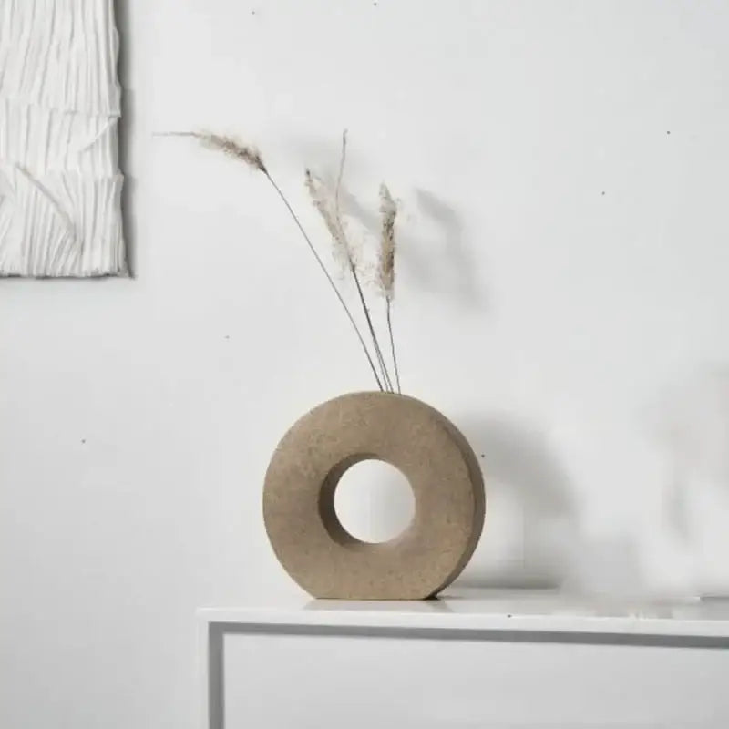 DecorBites™ elegant nordic matte beige concrete donut flower vase holding dried grasses for minimalist home decor