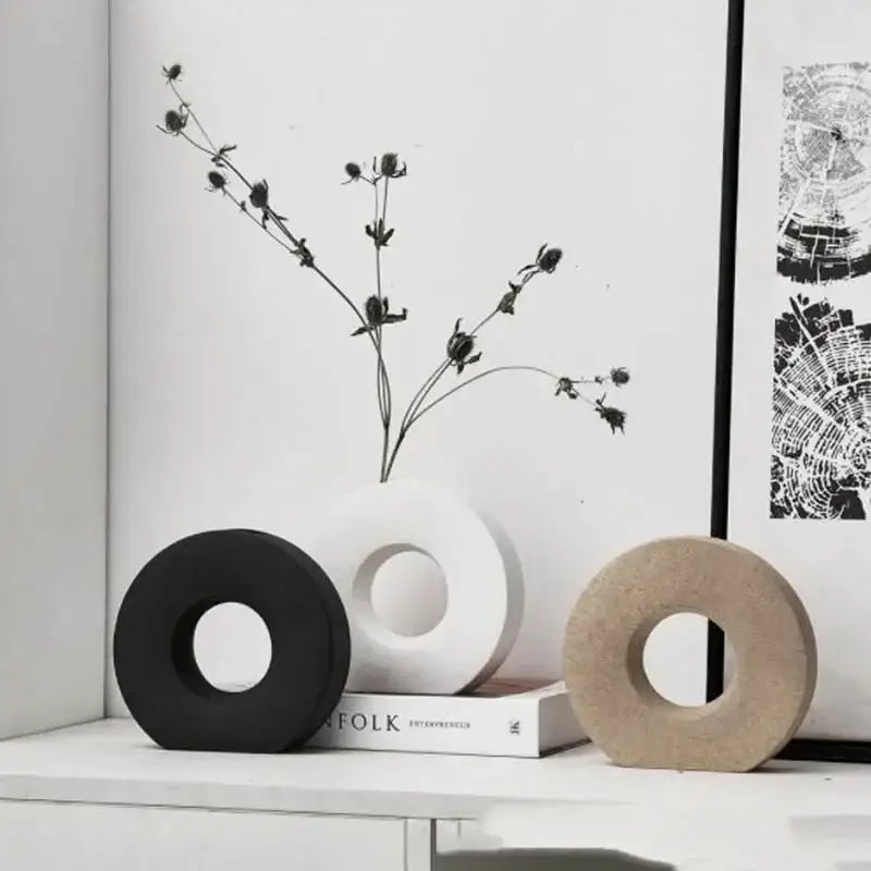 Three minimalist donut vases in black white and beige ceramic for elegant home decor and flower vase display