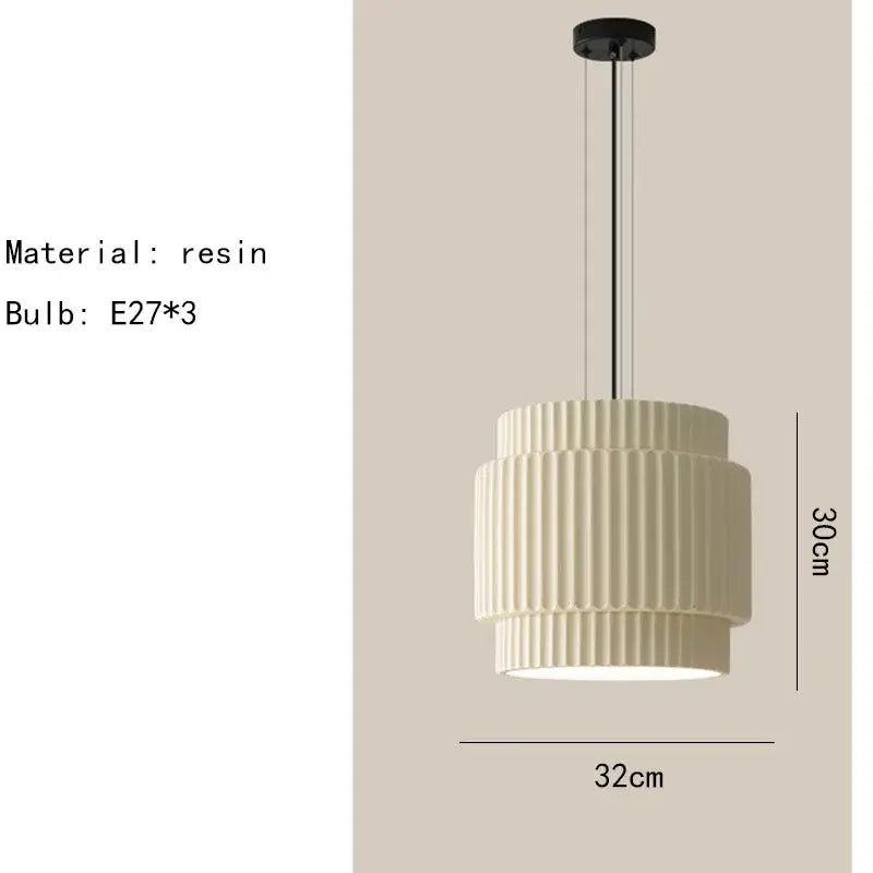 Cream-colored tiered fluted resin pendant light with black metal hardware by Decorbites elegant resin for dining room