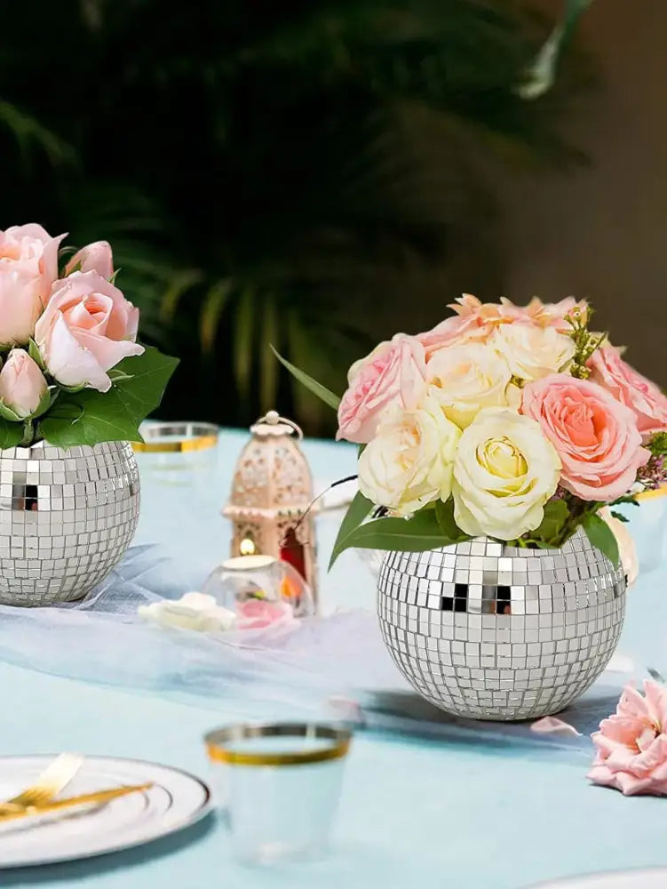 DecorBites™ elegant round glass vase with shiny silver disco ball design filled with pink and cream roses for home decor