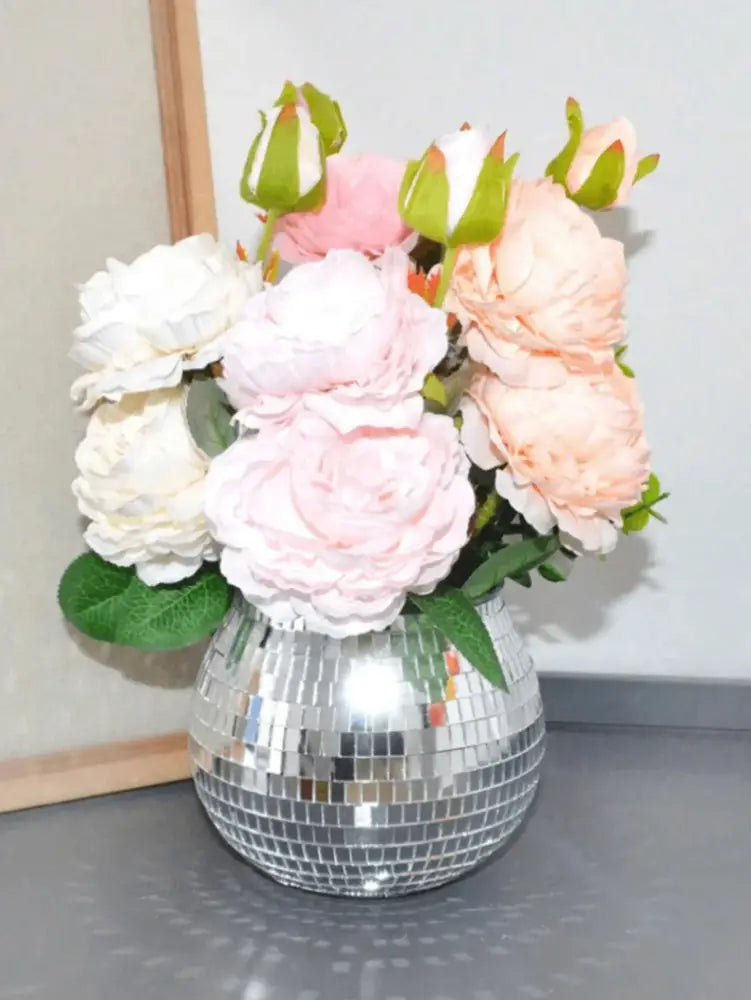 DecorBites™ elegant round glass vase in shimmering silver holding pink peach and white artificial roses with green leaves
