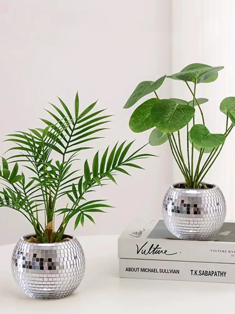 DecorBites elegant round glass vase set features two silver disco ball-style glass vases with green artificial plants
