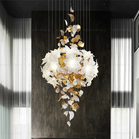 Elegant white and gold leaf chandelier with cascading sculptural design from decorbites elegant villa for living room light
