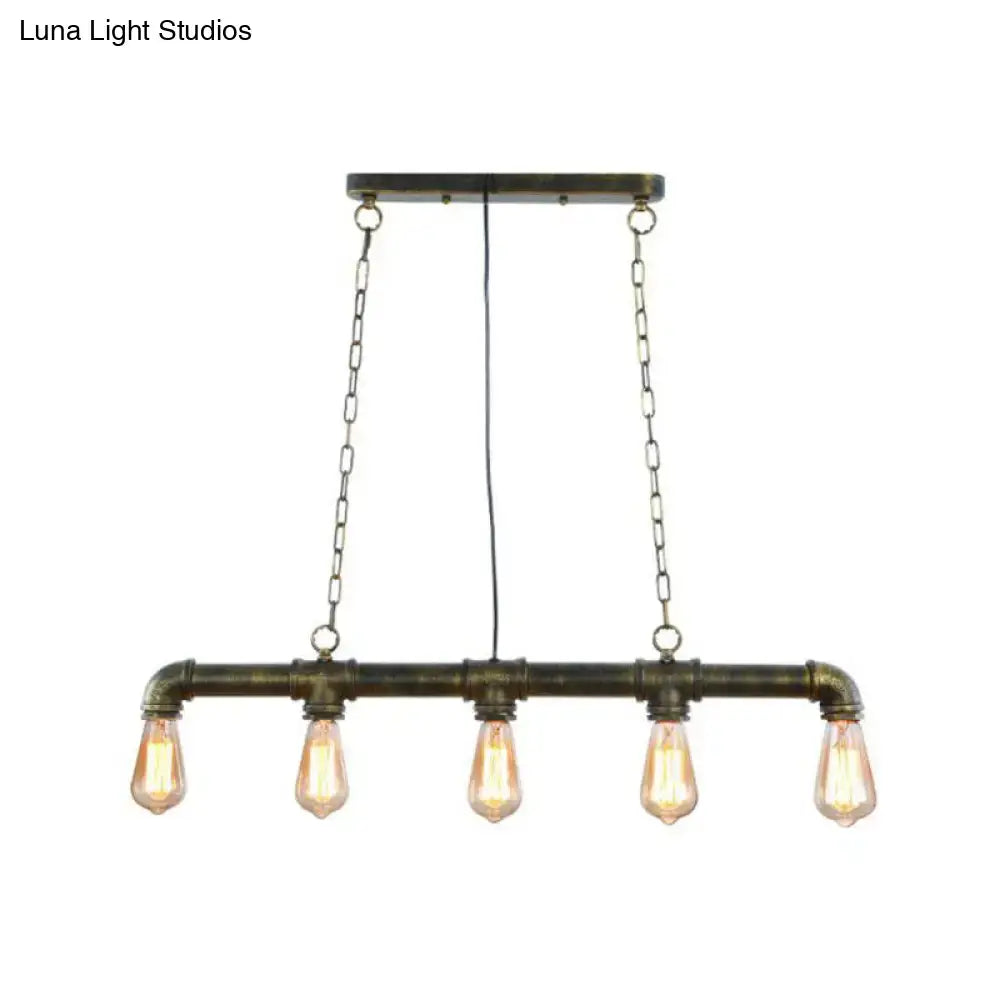 Industrial-style elongated pipe island pendant light with dark brass pipe frame and five exposed edison bulbs for dining room