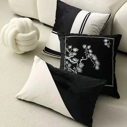 Black velvet cushion cover with white embroidered bamboo design and chain-stitched border by decorbites embroidered black white
