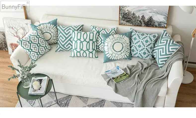 Set of seven decorbites embroidered blue teal and white geometric cushion covers in cotton for living room use