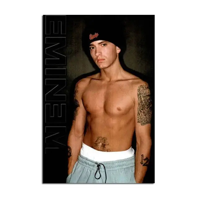 Black beanie with red embroidered logo paired with Eminem canvas wall art for stylish home decor display