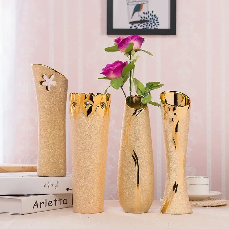Four elegant gold-plated ceramic vases with floral motifs for stylish home decor by DecorBites™ Europe