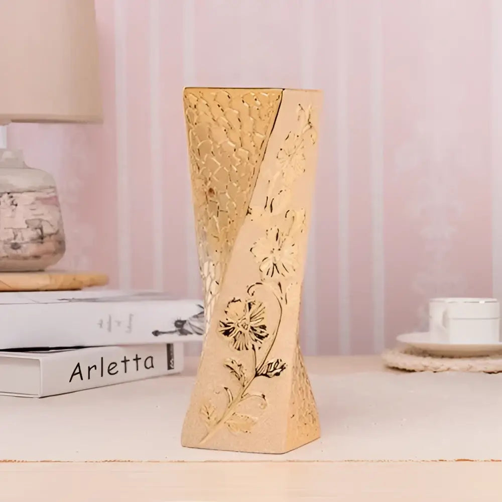 DecorBites Europe gold-plated ceramic vase with intricate floral carvings and tapered twisted design for home decor