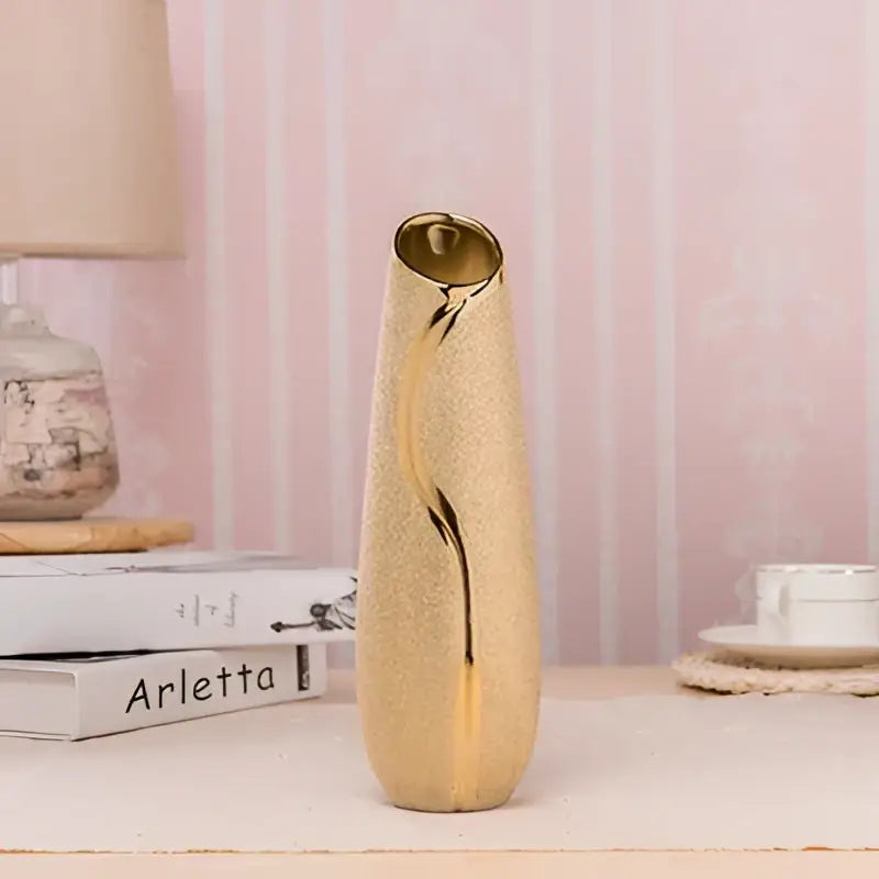Gold-plated ceramic vase with golden textured sleek curved design for home decor by decorbites europe