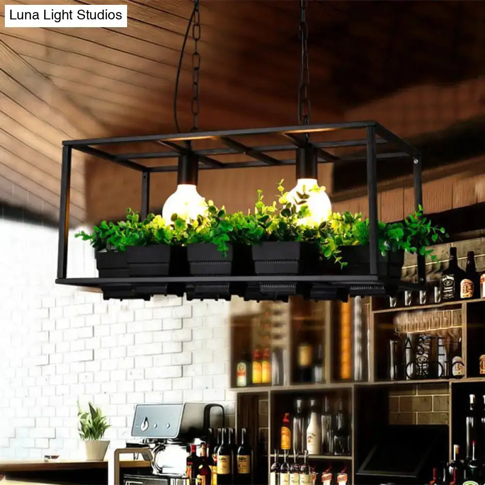 Black metal industrial e26 e27 light fixture with two bulbs and artificial plants in a white rectangle frame for living room