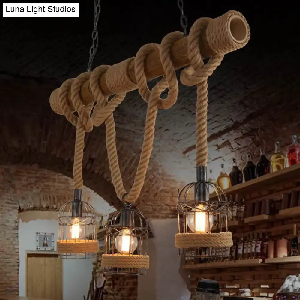 Rustic industrial farmhouse pendant light with brown iron bird cage fixtures, wooden pole, and rope accents with three bulbs