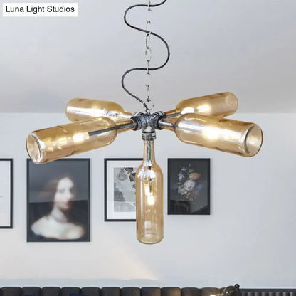 A rustic farmhouse chandelier with amber glass bottles in aged silver black finish and smoke gray blue accents