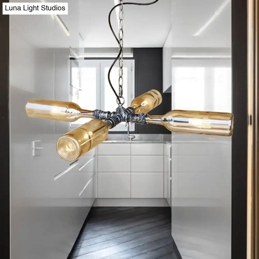 Industrial-style DecorBites farmhouse smoke gray blue glass hanging lamp with four amber wine bottles in aged silver black