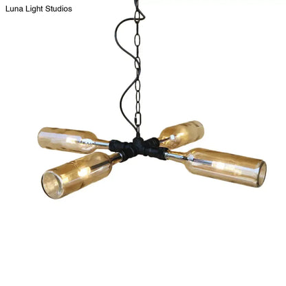 A rustic chandelier with four amber glass bottles on aged silver black metal frame in smoke gray blue farmhouse style