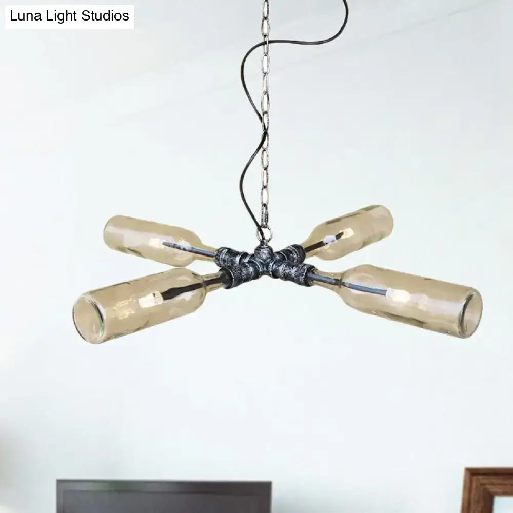 Industrial-style chandelier with four amber glass bottles on aged silver black metal hub and chain smoke gray blue finish