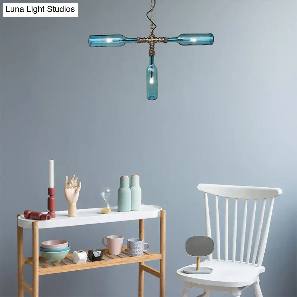 Blue glass bottle chandelier with brass hardware in aged silver black featuring smoke gray blue farmhouse style lighting