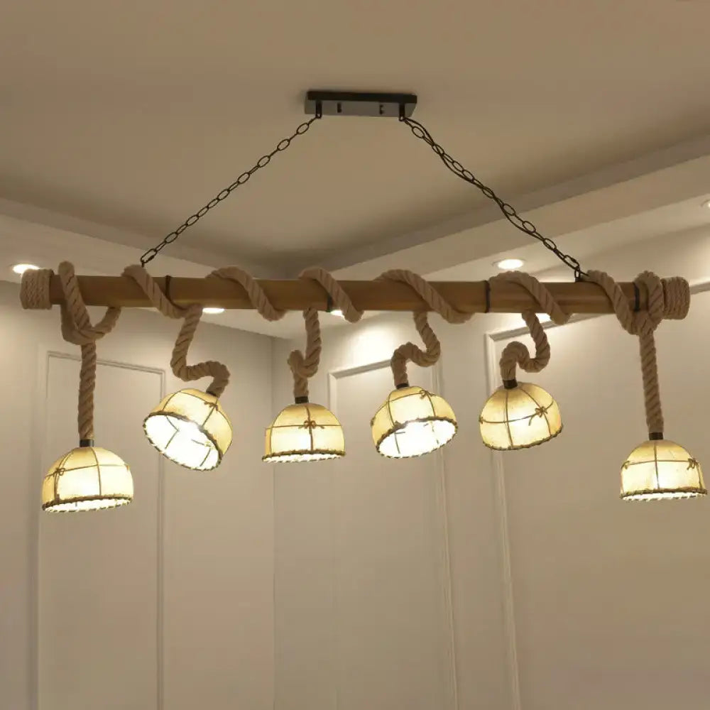 Nautical farmhouse wood bowl pendant lighting with rustic wood beam rope accents and five warm glass shades for restaurants