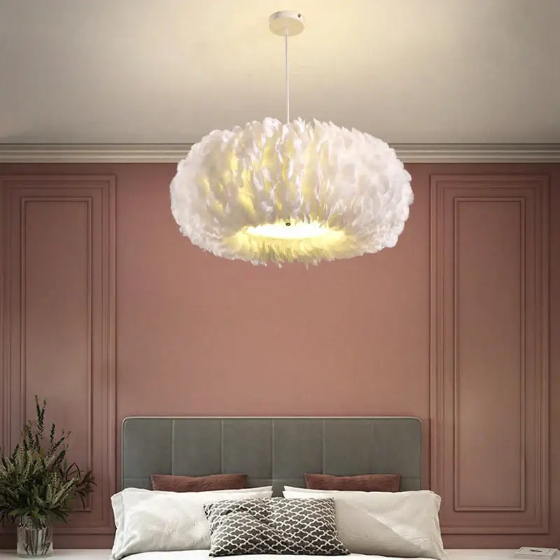 White soft feather decor led chandelier by decorbites with warm glow hanging above bedroom pendant light